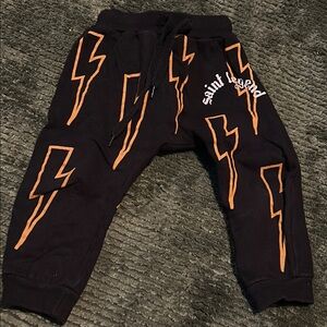 Saint Legend Black Joggers with Orange Lightning Bolts